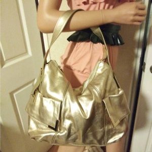 Michael Kors gold leather shoulder bag with side pockets & golden tone accents